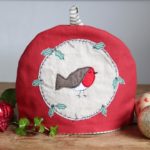 Poppy Treffry Christmas Robin tea cosy. I Pledge Indie Christmas support the UK economy. Shop independent this Christmas. Find independent online shops at Love Our Shops UK shopping directory.